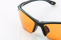 protective eyewear | photo of protective eyeglasses with an orange lens