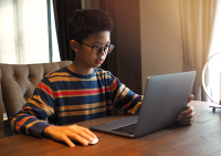 Computer Vision Syndrome | photo of Asian boy looking at laptop screen