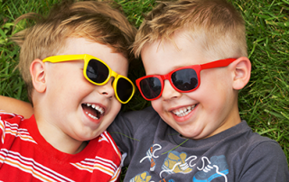 Do children really need sunglasses? | photo of 2 young boys wearing sunglasses