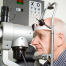 dilated eye exam | photo of oldr gentleman getting an eye exam