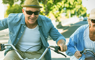 photo of a senior couple riding bikes