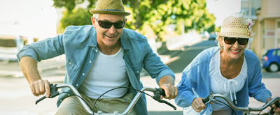 photo of a senior couple riding bikes