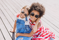 sunglasses for children | photo of two young girls wearing sunglasses