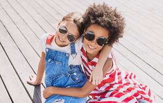 sunglasses for children | photo of two young girls wearing sunglasses