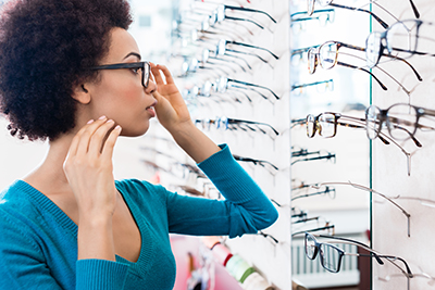 photo of Africa American woman trying on glasses